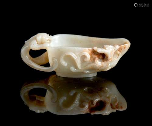 A pale celadon and russet flecked jade pouring vessel