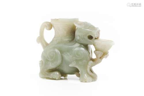 A Chinese carved celadon and russet jade lion-form vessel