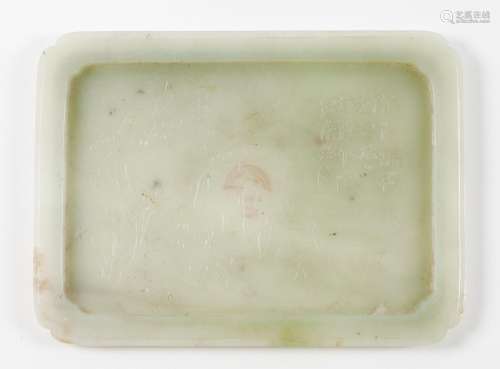 A carved jade rectangular cup stand