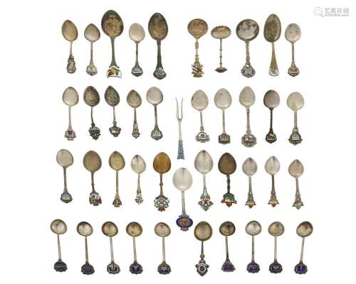 A group of silver souvenir spoons