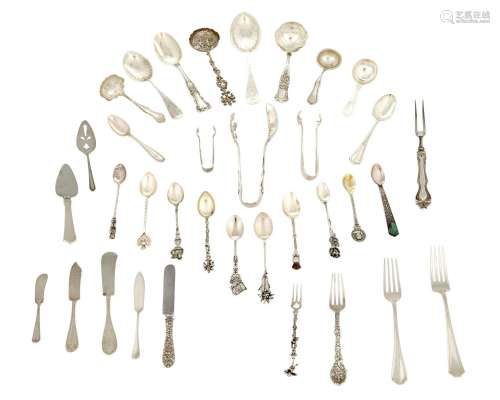 A group of silver flatware