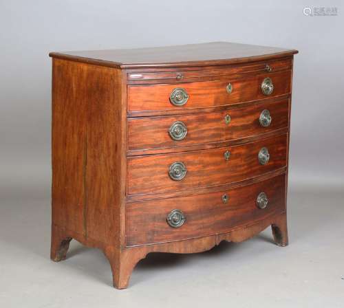 A late George III mahogany bowfront chest of four oak-lined ...