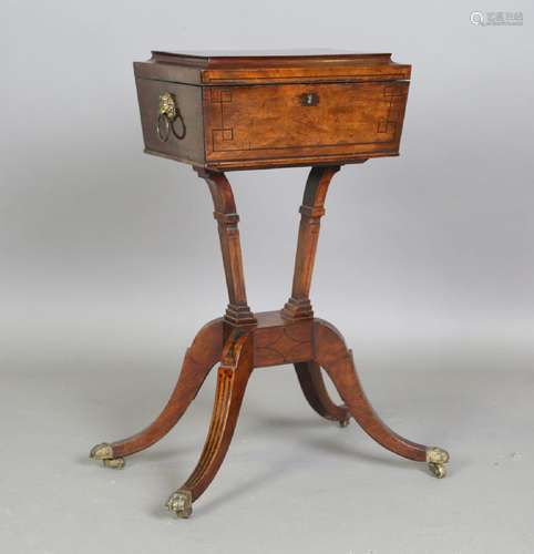 A Regency figured mahogany and ebony inlaid teapoy, the sarc...