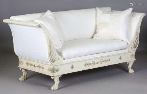 An early 19th century Empire style cream and gilt painted sh...
