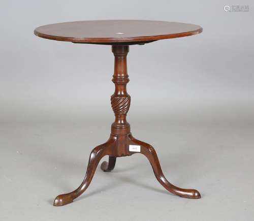 A 19th century mahogany oval tip-top wine table, on tripod l...