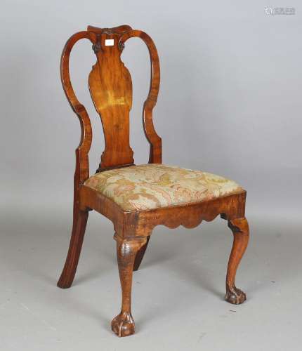 A Queen Anne walnut vase back side chair, the top rail carve...