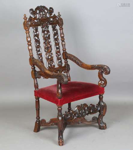 A 19th century Continental walnut armchair, the pierced back...