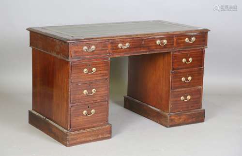 A late 19th/early 20th century walnut twin pedestal desk, th...