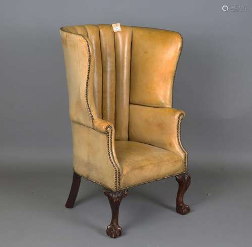 A 20th century George III style armchair, upholstered in stu...