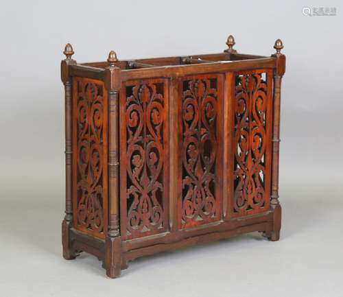 A late Victorian walnut three-division stick stand with pier...