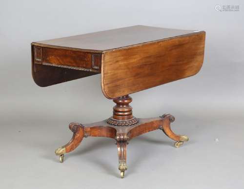 A Regency mahogany Pembroke table, on a turned column and fo...