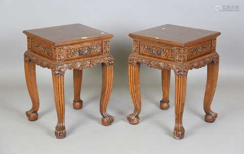 A pair of 20th century South-east Asian elm lamp tables, eac...