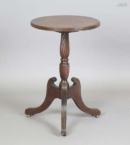 A Regency style mahogany circular tip-top wine table, on tri...