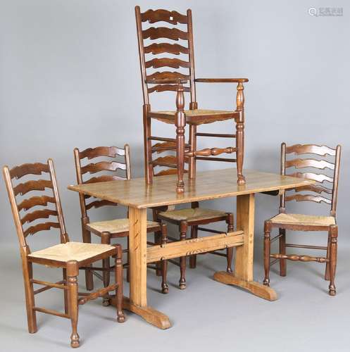 An early 20th century pale oak refectory dining table, heigh...