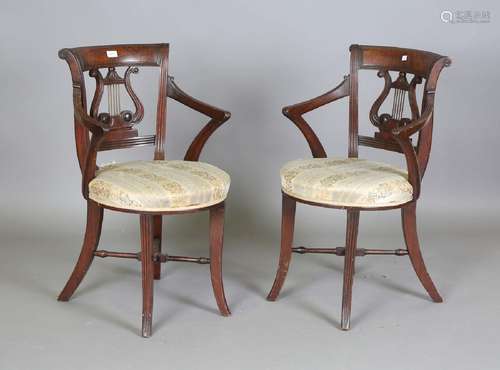 A pair of Regency style mahogany music chairs, possibly Iris...