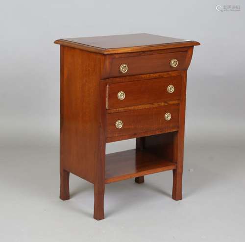 A 20th century Arts and Crafts style mahogany chest of three...