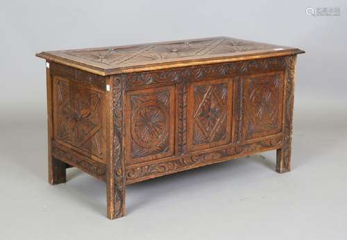 A 20th century carved oak coffer, height 50cm, width 92cm, d...