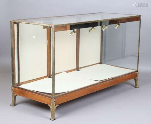 A mid-20th century walnut and brass framed shop counter disp...