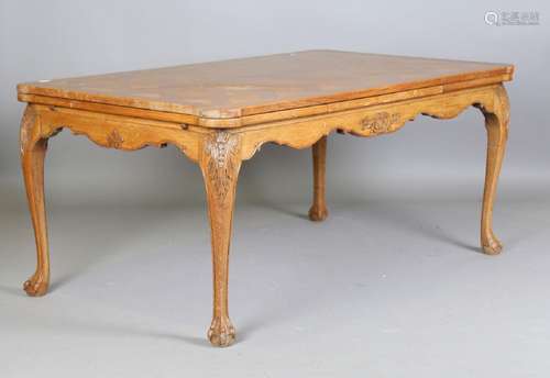 A 20th century French oak parquetry draw-leaf dining table, ...