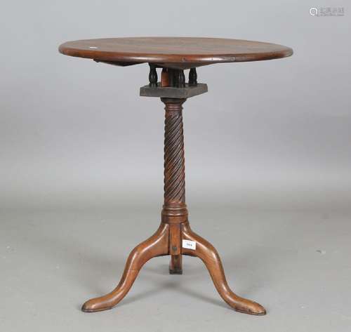 A George III and later mahogany tip-top wine table, fitted w...