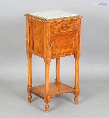 A late 19th century French pine marble-topped bedside cabine...