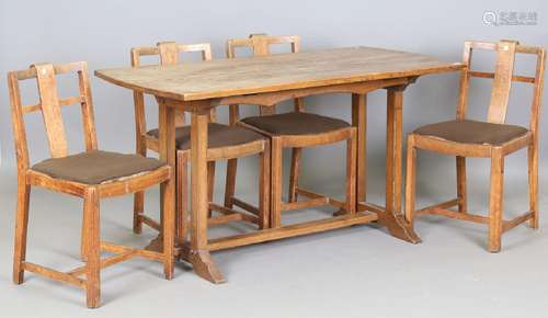 An early 20th century Arts and Crafts oak refectory dining t...