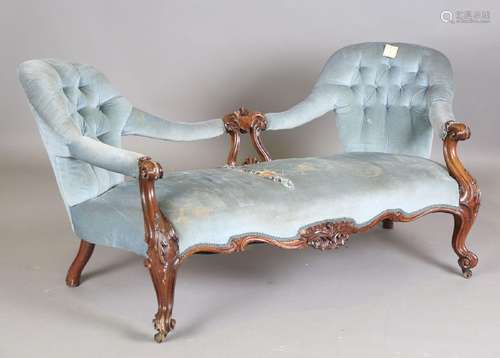 A mid-Victorian mahogany showframe conversation settee, rais...