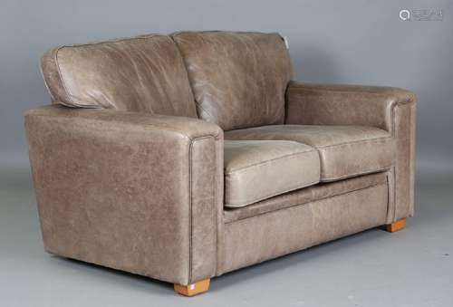 A modern brown leather two-seat settee, height 87cm, width 1...