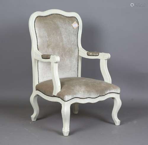 A modern French painted showframe armchair, upholstered in s...