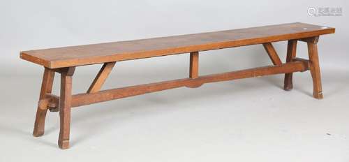 An early/mid-20th century Arts and Crafts oak bench, raised ...