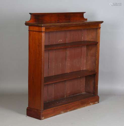 An Edwardian walnut open fronted bookcase, height 134cm, wid...