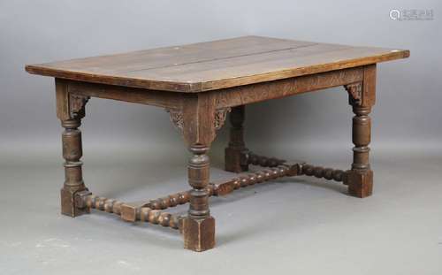 A late 19th century Jacobean Revival oak refectory table wit...