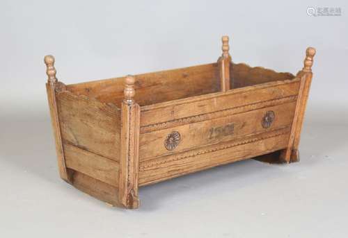 A 19th century provincial elm rocking cradle, height 52cm, l...