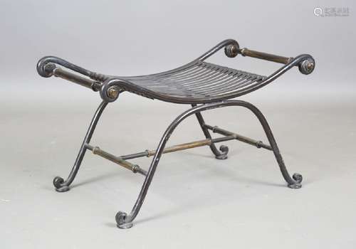 A 20th century wrought iron stool of 'X' framed form, height...