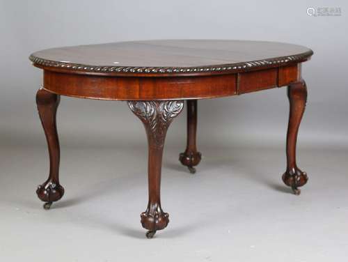 A George V mahogany extending dining table, the gadrooned to...