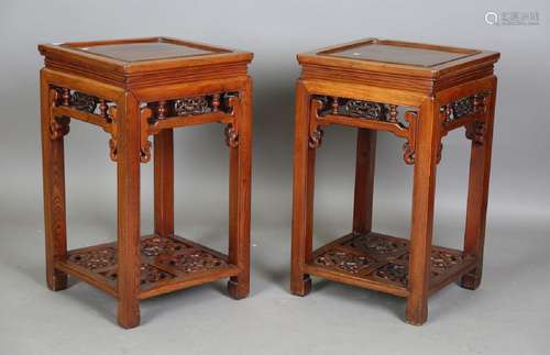 A pair of Chinese elm square tables, each panelled top above...