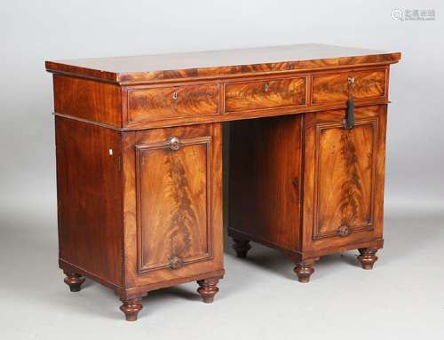 An early Victorian figured mahogany twin pedestal sideboard ...