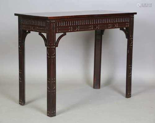 A George III mahogany side table, the later top above a carv...