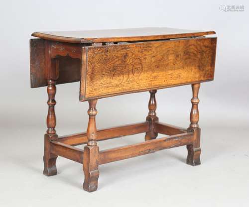 A late 17th century oak rectangular drop-flap occasional tab...