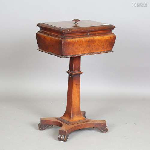 A Victorian mahogany teapoy, the hinged lid enclosing a comp...