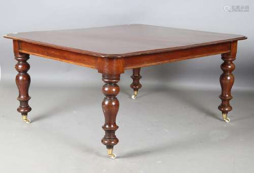 A Victorian mahogany dining table, the moulded top on turned...