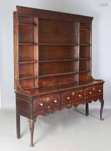 A George III provincial oak dresser, the shelf back above th...