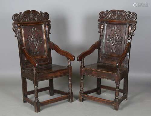 A pair of 17th century provincial oak Wainscot armchairs wit...