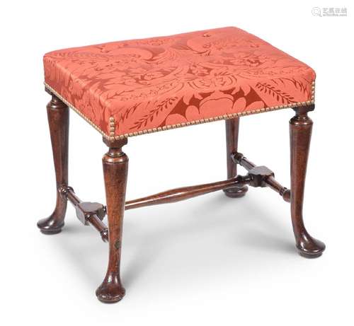 A GEORGE II WALNUT AND UPHOLSTERED STOOL, CIRCA 1730