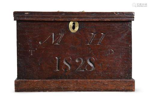 A CARVED OAK BOX, DATED 1828 BUT POSSIBLY EARLIER