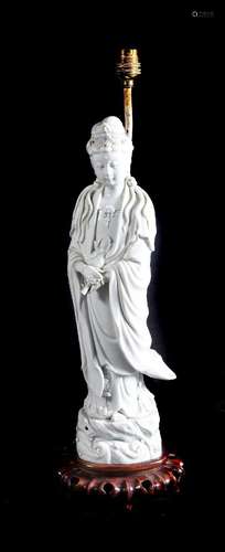 A STANDING DEHUA FIGURE OF GUANYIN, QING PERIOD AND NOW A LA...