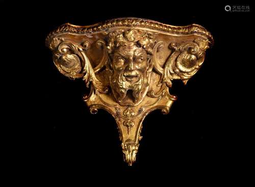 A LARGE GEORGE II CARVED GILTWOOD BACCHUS HEAD WALL BRACKET,...