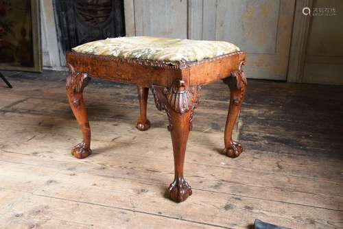 A GEORGE II CARVED WALNUT STOOL, CIRCA 1750