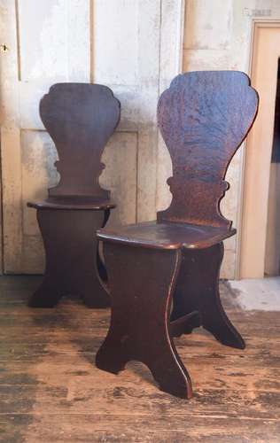 A PAIR OF GEORGE II OAK HALL CHAIRS, MID 18TH CENTURY