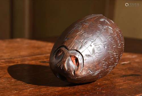 A GEORGE III CARVED COCONUT 'BUGBEAR' FOR THE 19TH REGIMENT ...